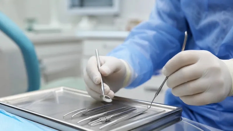 Dentist at a modern practice reception desk
